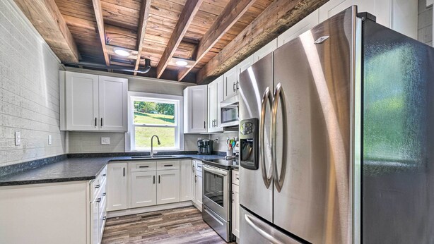 Microwave, oven, stovetop, blender - Waterfront Lake Cottage w/ Dock, Gentle Slope (Caryville)
