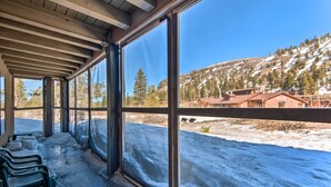 A covered outdoor area with benches and a view of a snow-covered landscape and buildings. - Walk to Ski Lift & Village: Lovely Kirkwood Condo! (Kirkwood)