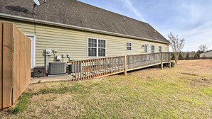A single-story house with a covered porch, a satellite dish, and an air conditioning unit. - Stokesdale Vacation Rental w/ Game Room! (Stokesdale)