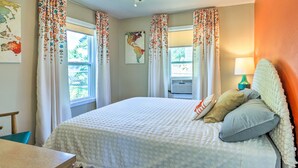 A bedroom with a bed, curtains, a ceiling fan, a map on the wall, and a lamp. - Modern Rapid City Duplex < 10 Mi to Natl Forest! (Rapid City)