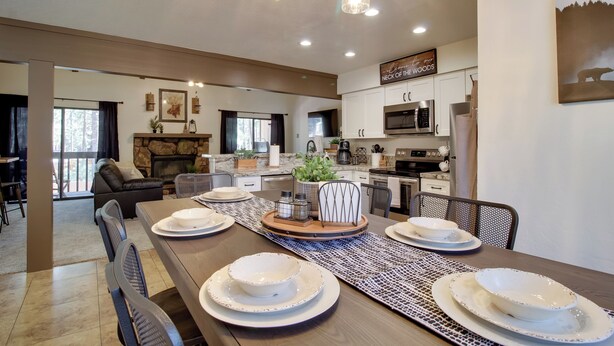 A modern kitchen with white cabinets, a built-in oven, and a microwave. - Forest-view Balcony: Pinetop-lakeside Condo (Pinetop)