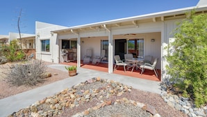 A modern house with a patio area featuring outdoor furniture and a stone garden. - Green Valley Abode w/ Pool Access & Mtn Views (Green Valley)