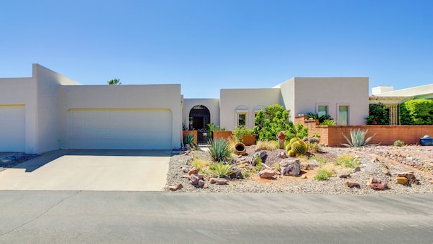 A modern two-story house with a garage, a landscaped garden with desert plants, and a clear blue sky. - Green Valley Abode w/ Pool Access & Mtn Views (Green Valley)