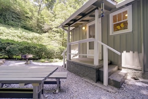 A wooden building with a porch and steps leading to a door. - Private Fire Pit & Creek: Bryson City Retreat! (Bryson City)