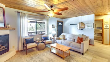 House (2 Bedrooms) | Living area | Fireplace, books