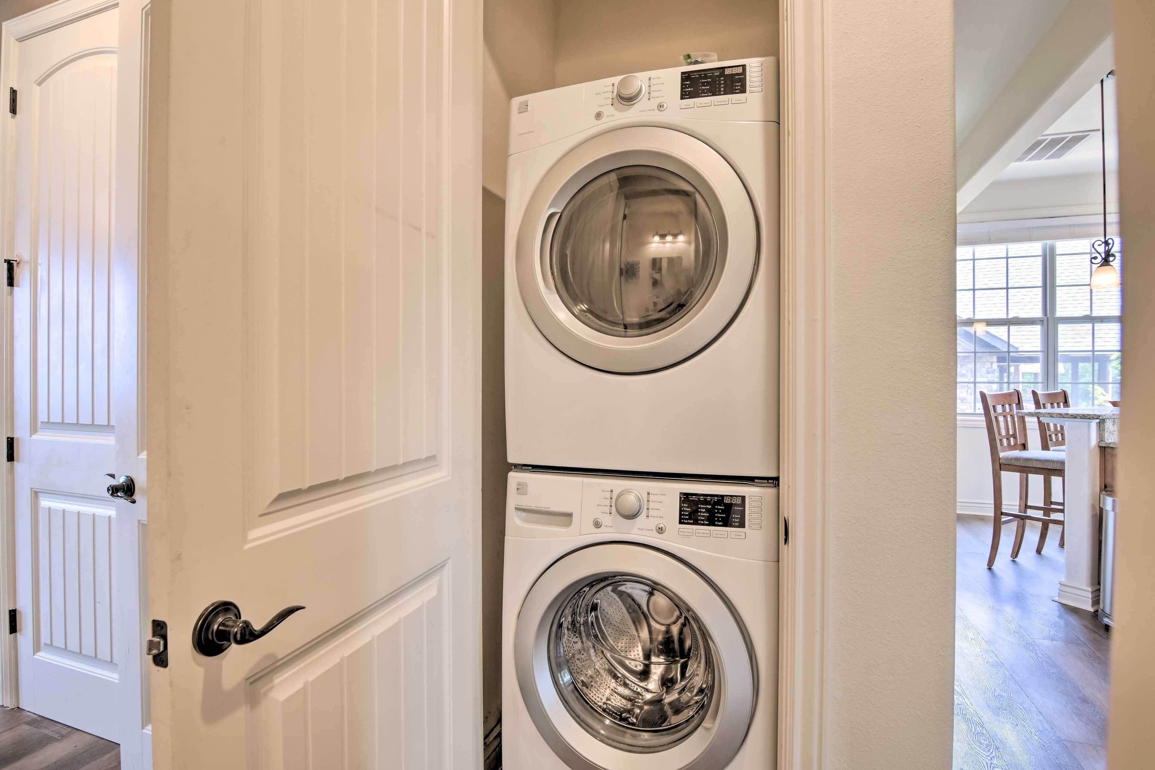 A laundry room with two stacked front-loading washing machines.