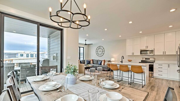 A modern kitchen with white cabinets, a microwave, and a sink. - Newly-built Lakeside Gem w/ Community Perks! (Huntsville)