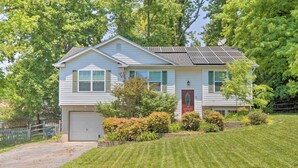 A single-story house with a garage, solar panels, and a well-maintained lawn. - Pet-friendly Mechanicsville Retreat w/ Deck! (Mechanicsville)