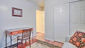 A room with a desk, chair, and a clock on the wall. - Pet-friendly Prescott Townhome w/ Fireplace! (Prescott)