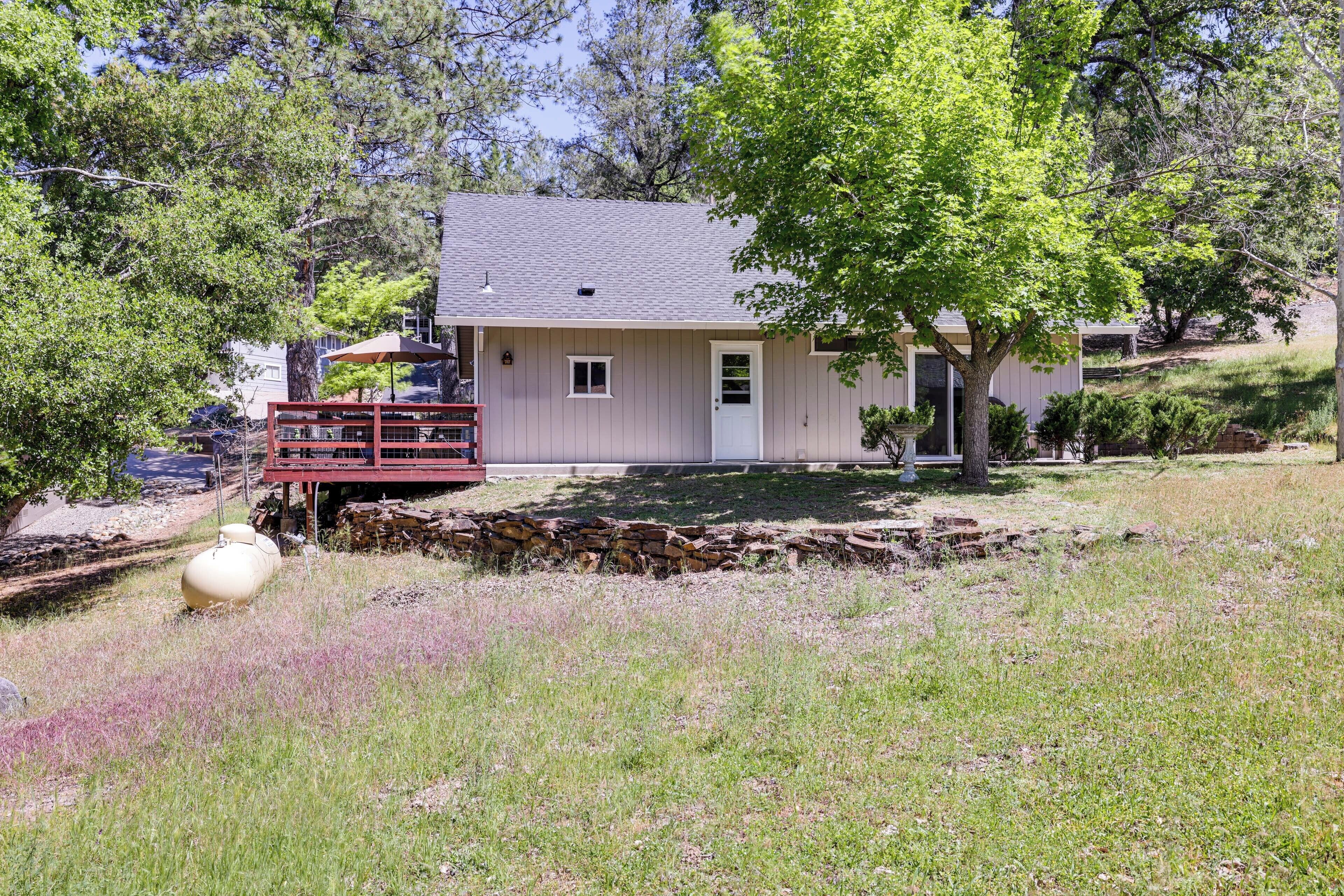A single-story house with a sloped roof, a front porch, and a small attached garage.
