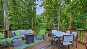 A deck with outdoor furniture, including a sofa, chairs, and a table. - Secluded Leesburg Retreat w/ Private Hot Tub! (Leesburg)