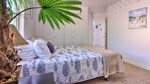 A bedroom with a large bed, a potted plant, and a painting on the wall. - Home w/ Game Room & Fire Pit: 30 Min to Zion! (La Verkin)