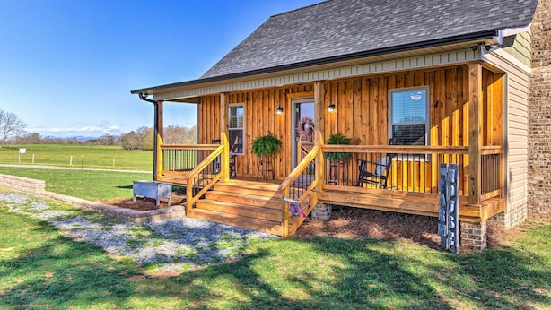 A wooden cabin with a porch, steps, and a small outdoor seating area. - Near Wineries & Hiking: Lawndale Home w/ Fire Pit! (Lawndale)