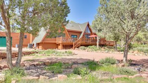 A log cabin with a deck and a covered patio. - Hot Tub & Mtn View: Dog-friendly Payson Getaway! (Payson)