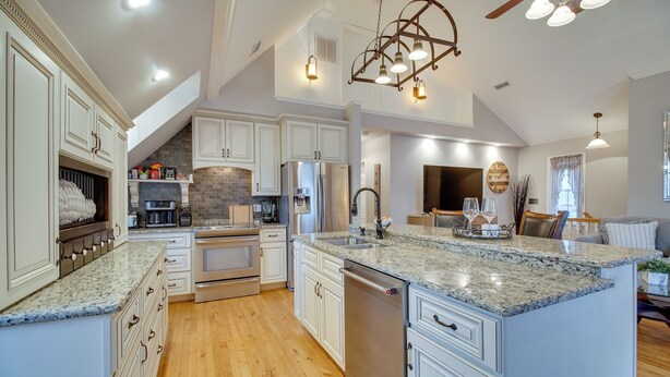 A spacious kitchen with white cabinetry, granite countertops, and stainless steel appliances. - Cozy Virginia Vacation Rental w/ Seasonal Pool! (Nokesville)