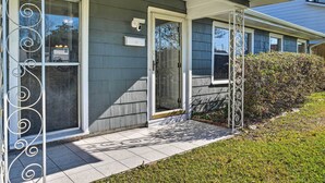 A house with a covered porch, a security camera, and a mailbox. - Pet-friendly Home w/ Patio - 3 Mi to Houston Zoo! (Houston)