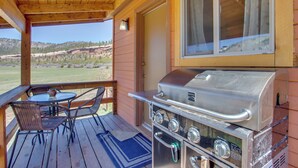 A covered outdoor area with a grill, seating, and a view of the landscape. - Cozy Dolores Getaway: Hike, Fish + More! (Dolores)