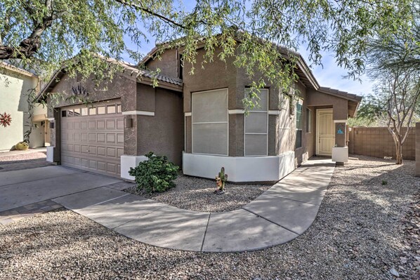 A single-story house with a garage, a covered patio, and a small garden area with a cactus. - Superstition Mtn Views & Fire Pit: Gold Canyon Gem (Gold Canyon)
