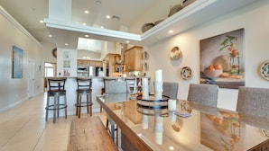 A spacious kitchen with high ceilings, modern cabinetry, and a central island. - Lake Havasu City Escape w/ Pool, Patio & Grill! (Lake Havasu City)