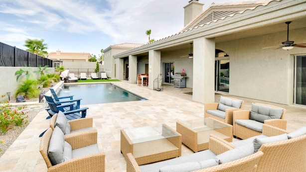 A poolside area with wicker furniture, a barbecue, and a covered patio. - Lake Havasu City Escape w/ Pool, Patio & Grill! (Lake Havasu City)