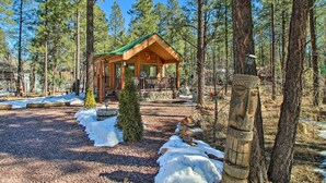 A wooden cabin with a green roof, surrounded by a forest. - Lakeside Cabin w/ Fire Pit ~ 4 Mi to Show Low Lake (Lakeside)