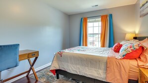 A bedroom with a bed, a desk, and a chair. - Huntsville Vacation Rental < 5 Mi to Airport! (Huntsville)