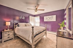 A bedroom with a bed, nightstand, dresser, and a ceiling fan. - Quiet Elizabethville Home w/ Fire Pit + Views (Elizabethville)