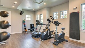 A home gym with treadmills, elliptical machines, and exercise balls. - Elegant Loveland Condo < 5 Mi to Old Town! (Loveland)