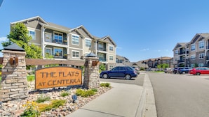A residential area with a sign reading "The Flats at Centerra." - Elegant Loveland Condo < 5 Mi to Old Town! (Loveland)