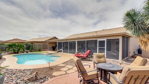 A backyard with a swimming pool, patio furniture, and a covered outdoor area. - Rustic Tucson Vacation Rental w/ Pool & Spa! (Saddlebrooke)
