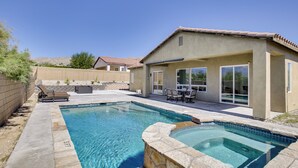 A backyard with a swimming pool, patio furniture, and a covered seating area. - 'casa Del Sol' - Cozy Oasis in Desert Hot Springs! (Desert Hot Springs)