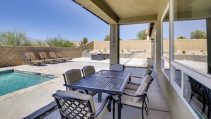 A covered patio with a pool, outdoor seating, and a view of the surrounding landscape. - 'casa Del Sol' - Cozy Oasis in Desert Hot Springs! (Desert Hot Springs)
