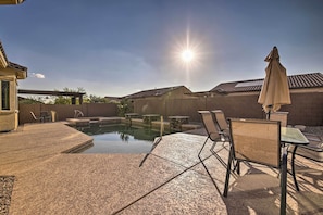 A backyard with a swimming pool, outdoor furniture, and a pergola. - Updated Goodyear Escape: Remote-work Friendly (Goodyear)
