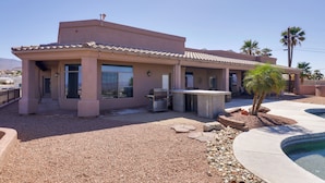 A modern house with a patio, outdoor grill, and a swimming pool. - Infinity Pool & Lake Views: Havasu Group Escape (Lake Havasu City)