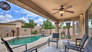 A covered outdoor area with a pool, chairs, and a ceiling fan. - Bbq-ready Oasis Near Golfing + Surprise Stadium! (Surprise)