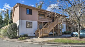 A two-story building with a wooden staircase leading to the upper floor. - Updated Wilmington Retreat ~ 2 Miles to Uncw! (Wilmington)
