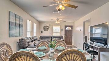 Enjoy meals in this stylish dining area with a round table and comfortable seating for six.