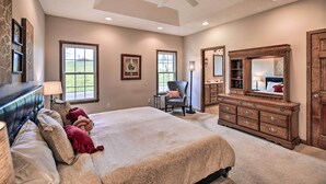 A bedroom with a large bed, a dresser, a chair, and a ceiling fan. - Pet-friendly Abingdon Abode w/ Yard & Grill! (Abingdon)