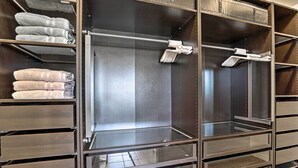 A walk-in closet with multiple shelves and drawers, some containing folded towels. - Great Salt Lake House: 5,000 Sq Ft, Mtn Views! (Kaysville)