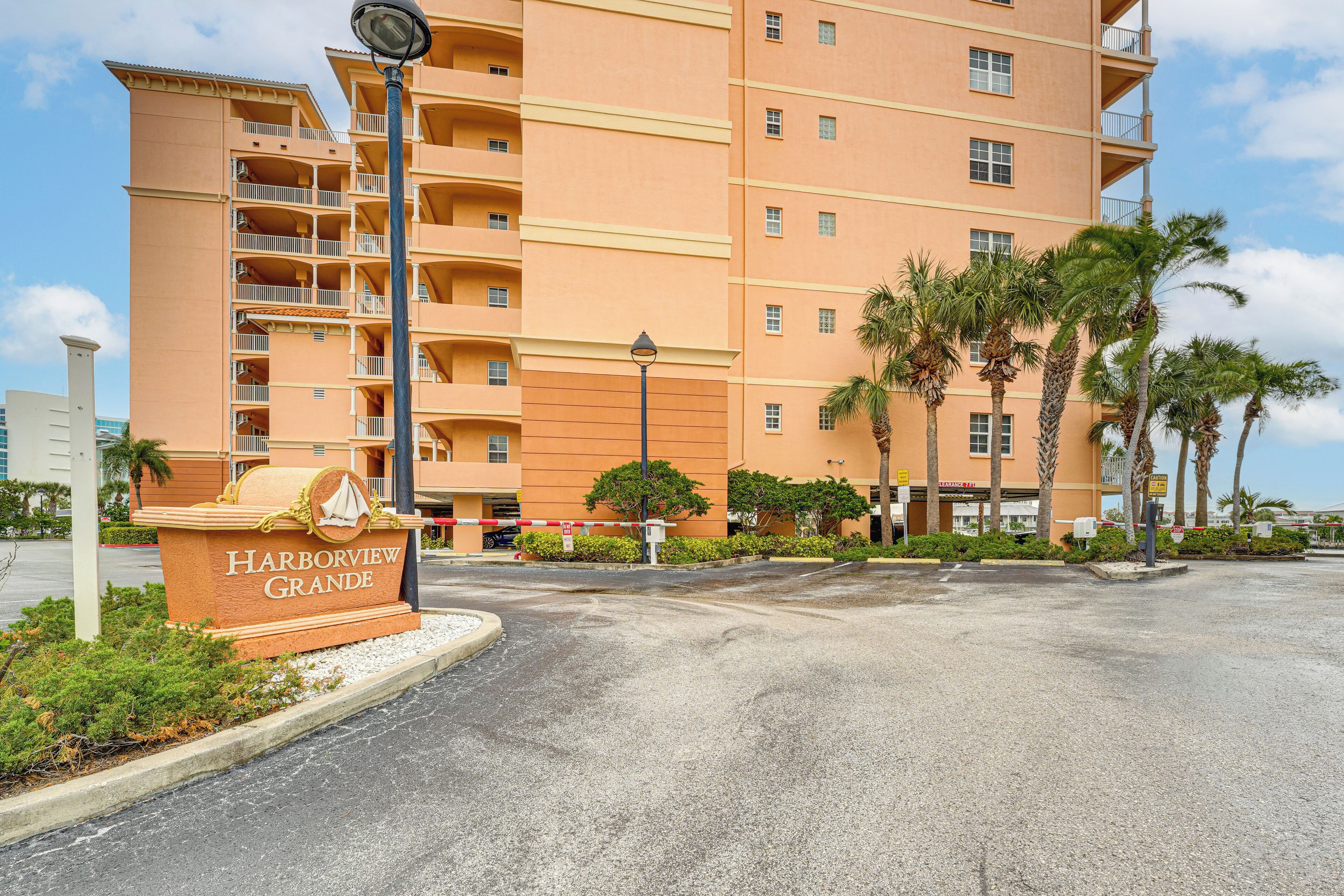 A multi-story hotel with a sign reading "Harborview Grande".