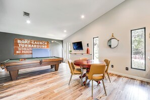 Enjoy a game of pool or dine in comfort with a view of the outdoors.