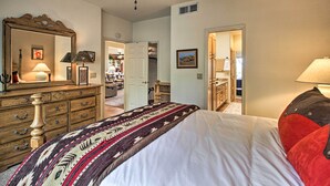 A bedroom with a bed, dresser, and a ceiling fan. - Oro Valley Getaway w/ Patio, BBQ & Mountain Views! (Oro Valley)