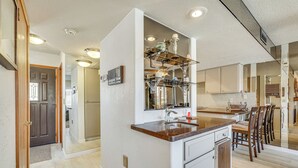 A modern kitchen with a central island, built-in appliances, and a breakfast bar. - Walk to Lake Havasu Beaches: Condo w/ Pool Access! (Lake Havasu City)
