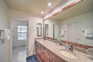 A bathroom with a double sink vanity, a large mirror, and a potted plant. - Scenic Sapphire Condo w/ Deck + Gas Grill! (Sapphire)