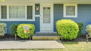 A single-story house with a front door, two windows, and a welcome sign. - Bayville Getaway w/ Fire Pit - 2 Mi to Beach! (Bayville)