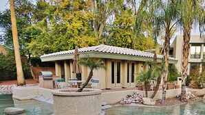 A pool area with a house, outdoor furniture, and palm trees. - Walk to Fashion Park! Phoenix Abode w/ Pool Access (Phoenix)