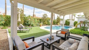 A covered patio area with outdoor furniture, a pool, and a well-maintained garden. - 6 Mi to Lookout Mountain: Scottsdale Home w/ Grill (Scottsdale)