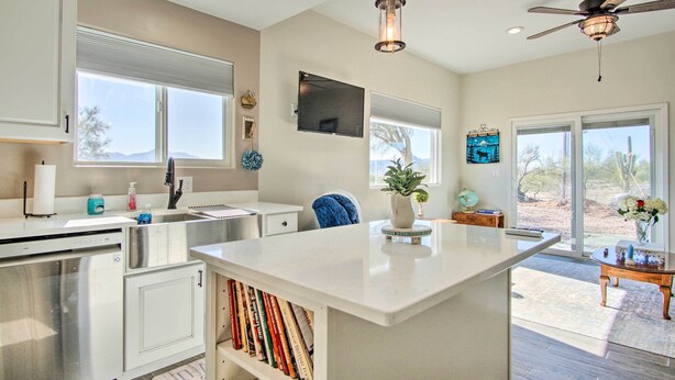 A modern kitchen with a central island, built-in appliances, and large windows. - Tucson Vacation Rental ~ 5 Mi to Nat'l Park (Tucson)