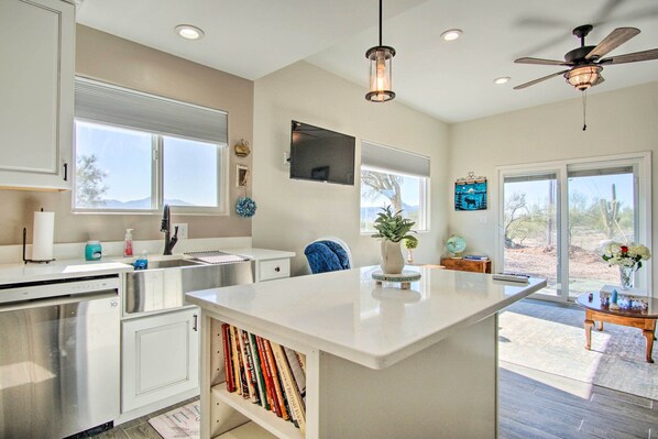 A modern kitchen with a central island, built-in appliances, and large windows. - Tucson Vacation Rental ~ 5 Mi to Nat'l Park (Tucson)