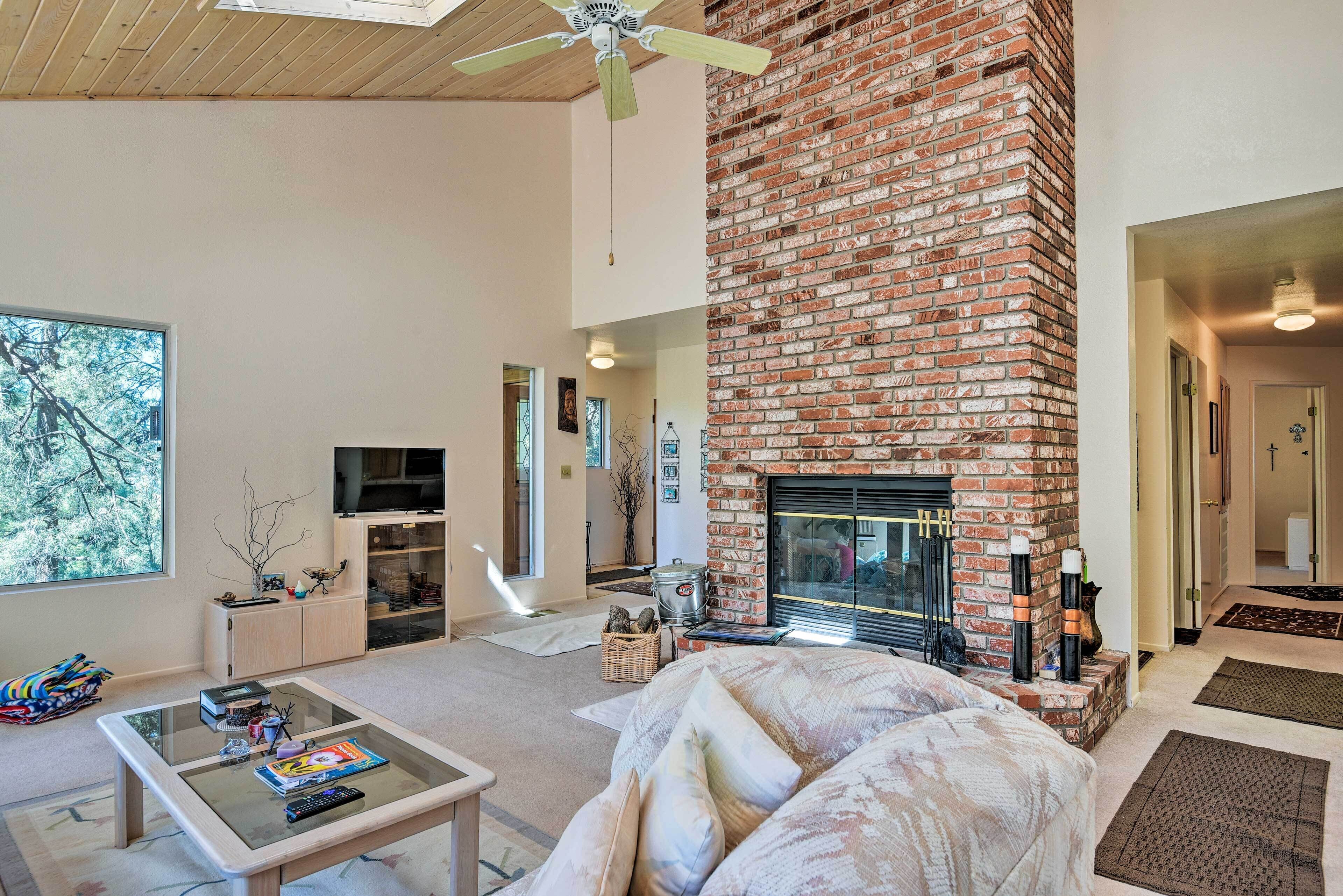 TV, fireplace, books